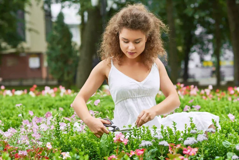 gorgeous-young-woman-enjoying-gardening-trimming-plants-with-scissors-copyspace-happiness-vitality-positivity-hobby-lifestyle-nature-enjoyment-concept